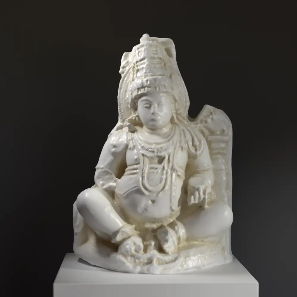 Escultura de Yaksha con detalles intrincados y acabado en pátina de mármol y bronce.