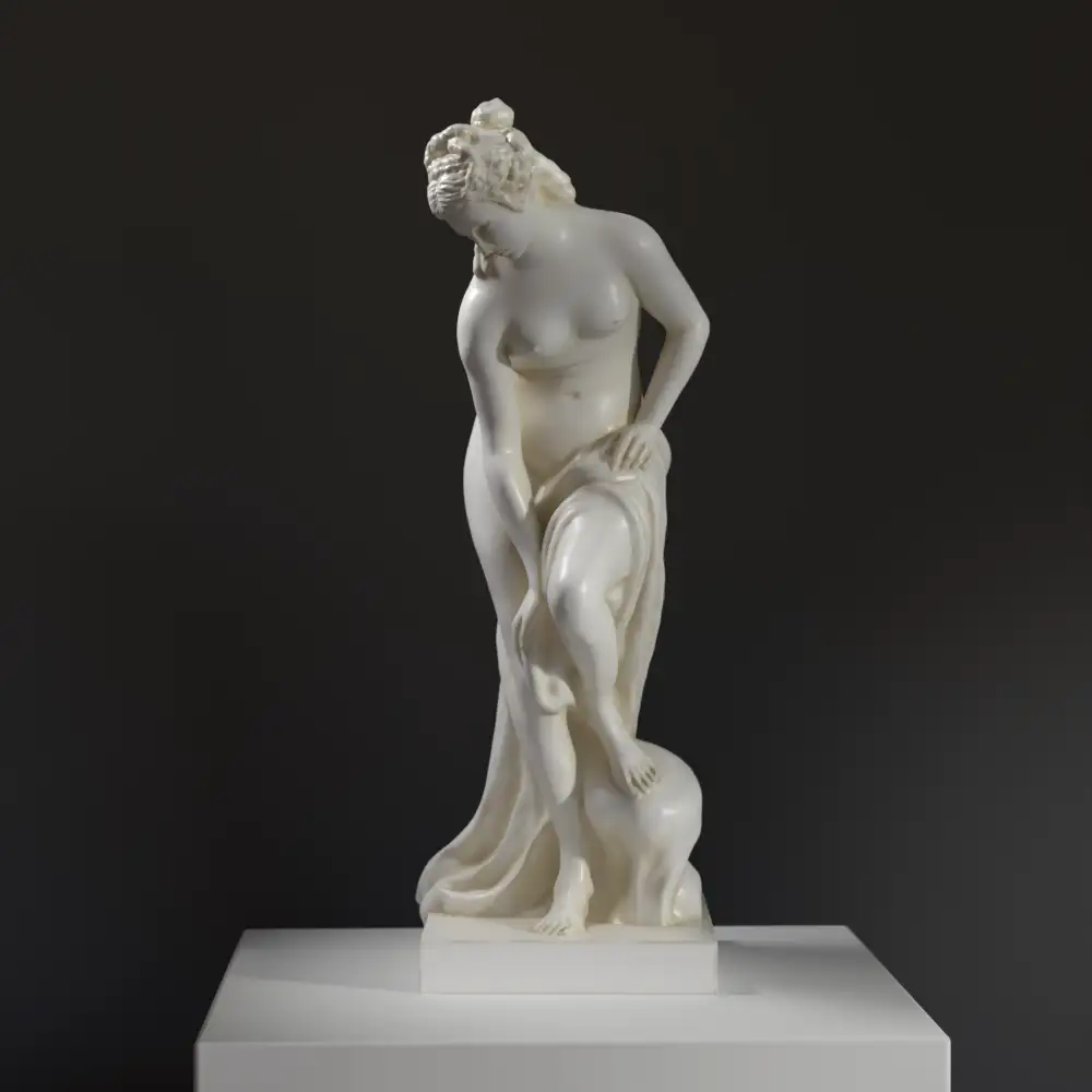 Escultura de la Bañista también conocida como Venus en el Louvre de París, mostrando su elegancia y detalle.