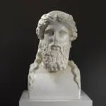 Busto de Herm de una divinidad barbada en resina con efecto de mármol y bronce.