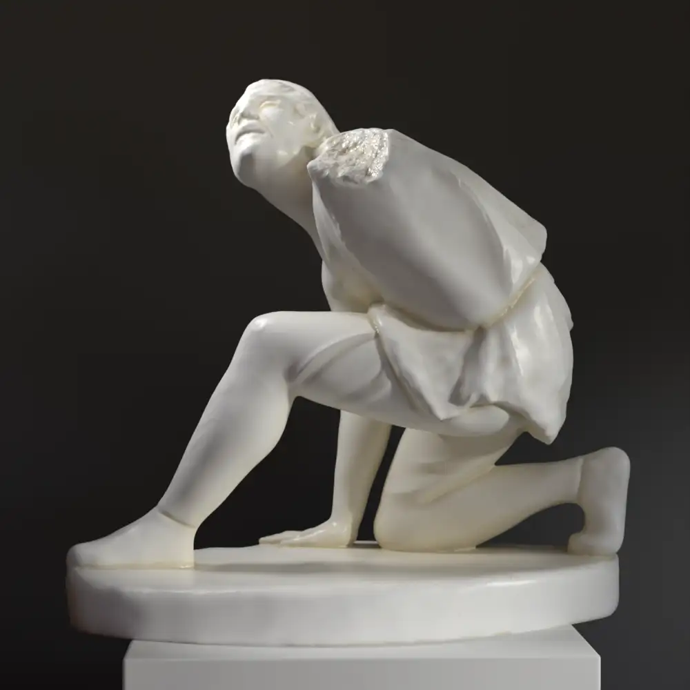 Escultura del Persa Arrodillado en resina con acabado de mármol y bronce.