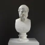 Busto de Heráclito en resina con acabado de mármol y bronce.
