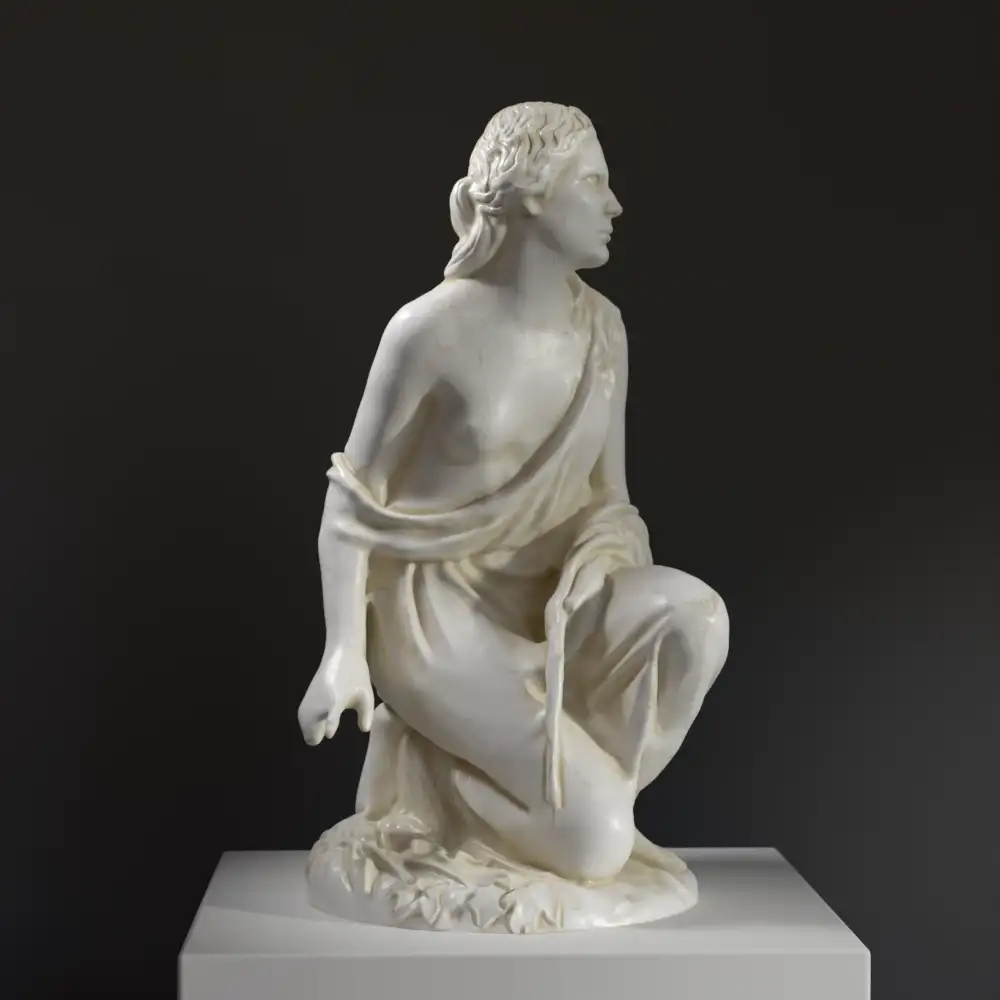 Sculpture de Ruth Glanant à genoux, ramassant des épis de blé.