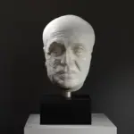Buste de la tête d'un homme mature en résine avec finition marbrée et bronze.