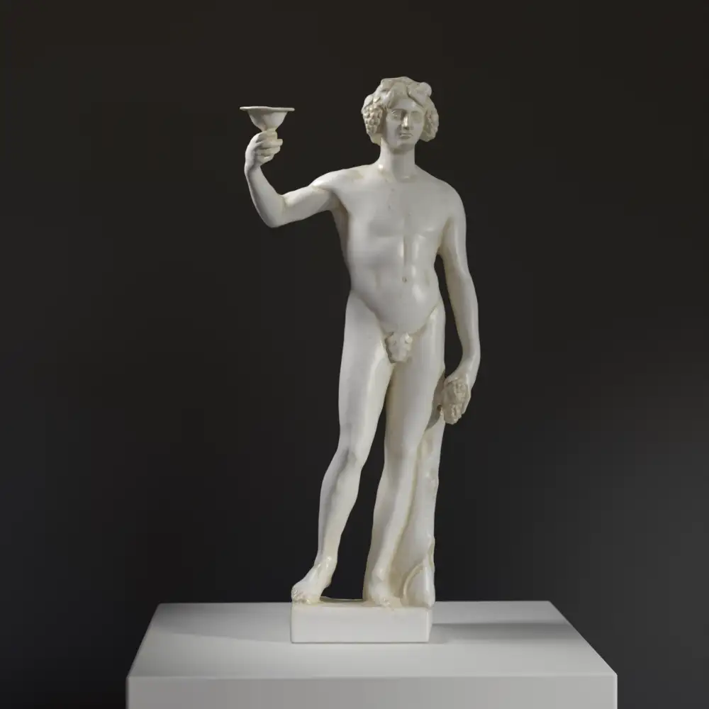 Statua di Dionisio in resina con finitura marmorea.