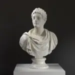 Busto del cosiddetto Commodo in resina con finitura a patina.